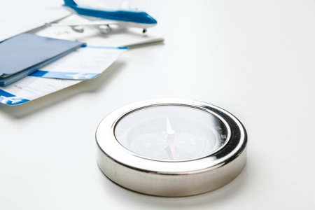 Time to Travel. Idea for tourism with flight tickets and compass on white