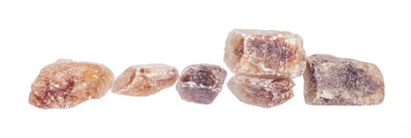 Pile of brown granulated sugar isolated on white backgroundの写真素材