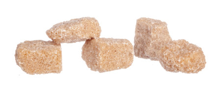 Brown cane sugar cubes isolated on white backgroundの写真素材