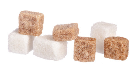 White refined sugar and brown unrefined sugar cubesの写真素材