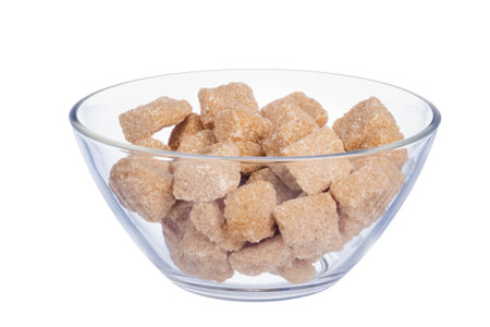 sugar cube in the bowl on white backgroundの写真素材