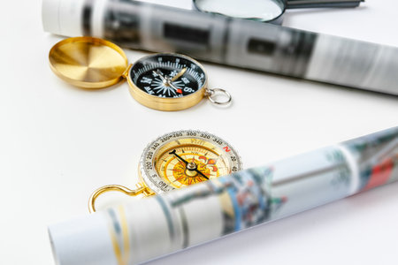 Nautical compass and empty magazine pages with copy spaceの写真素材