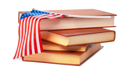 USA flag with pile of books isolated on white backgroundの写真素材
