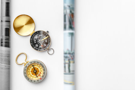 Nautical compass and empty magazine pages with copy spaceの写真素材