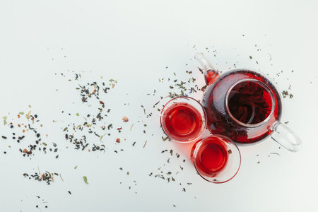 A cup with tea and teapot stand on table top viewの写真素材
