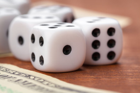 Playing Dices and Stack of American Dollars Bills.の写真素材