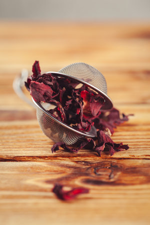 dry leaves hibiscus tea on wooden tableの写真素材
