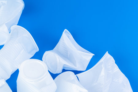 Disposable colored plastic cups garbage. Garbage and pollution conceptの写真素材