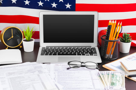 4th of July American Independence Day USA flags decorations in office desk with computerの写真素材