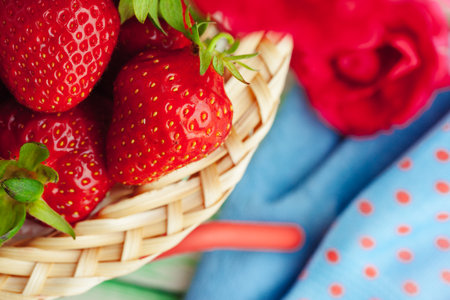 Fresh strawberry in basket on wooden backgroundの写真素材