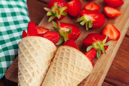 Fresh strawberry in waffle cone. Creative food conceptの写真素材