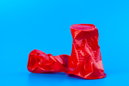 Disposable colored plastic cups garbage. Garbage and pollution conceptの写真素材