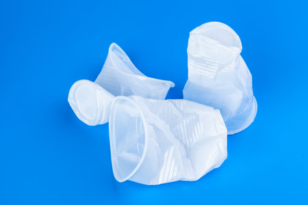 Disposable colored plastic cups garbage. Garbage and pollution conceptの写真素材