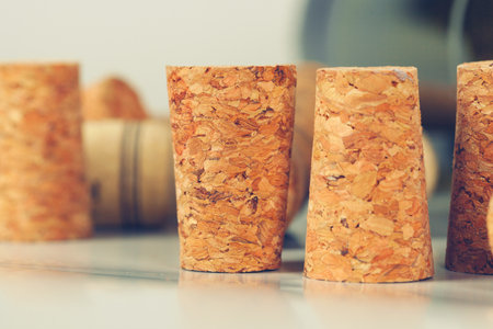 Heap of assorted wine corks on wooden backgroundの写真素材