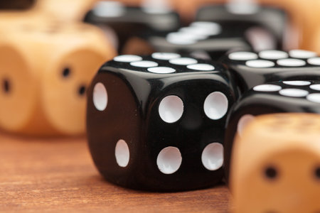 Dice on a wooden table. Concept for business risk.