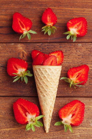 Fresh strawberry in waffle cone. Creative food conceptの写真素材