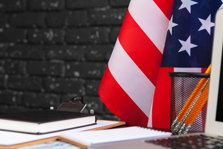4th of July American Independence Day USA flags decorations in office desk with computerの写真素材