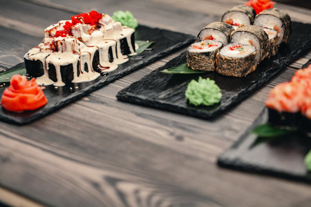 Healthy food. Japanese restaurant. Sushi roll on a black backgroundの写真素材