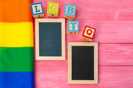 Bright rainbow gay flag on wooden background and blank spaceの写真素材