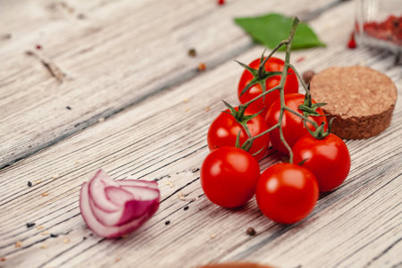 Fresh red tomatoes on background or light rustic table. Tomato varietyの写真素材