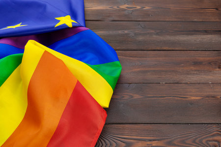 LGBT and EU flag together on wooden backgroundの写真素材