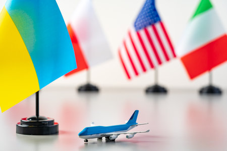 Flags and toy airplane close up. Travel conceptの写真素材