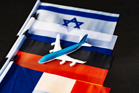 Flags and toy airplane close up. Travel conceptの写真素材