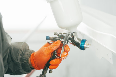 Airbrush paint gun in paint in car service stationの写真素材