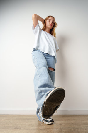 Portrait of young beautiful cute teen girl posing at camera