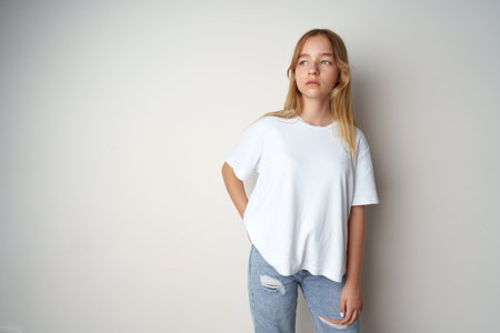 Portrait of young beautiful cute teen girl posing at cameraの写真素材