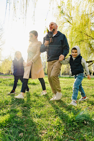 Happy family on a walk in the parkの写真素材
