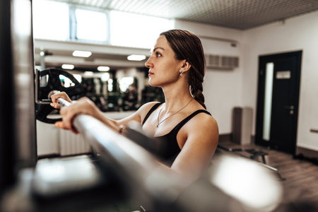 Portrait of a female personal trainer in a gym