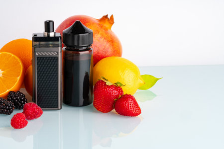 Vape and smoking liquid with fruit flavor on white backgroundの写真素材