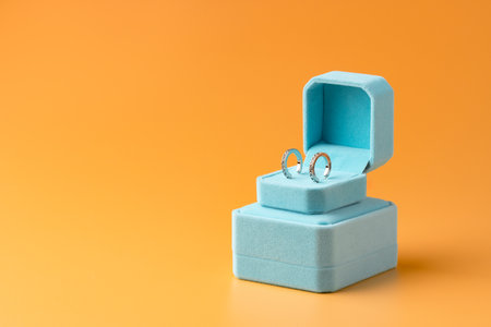 Blue jewelry box on yellow background close upの写真素材