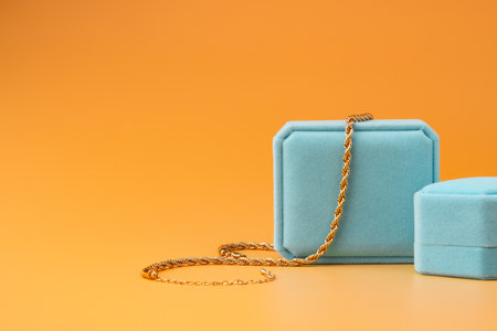 Blue jewelry box on yellow background close upの写真素材