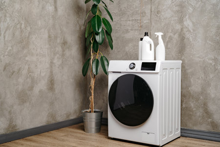 Washing machine in a gray modern laundry room