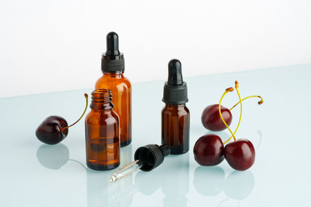 Vape liquid with cherry flavor on white backgroundの写真素材