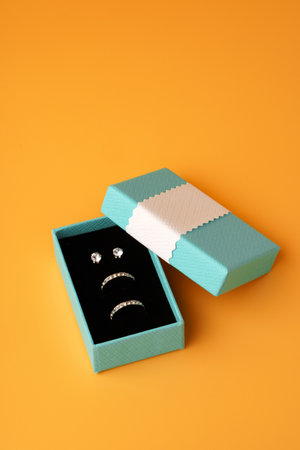 Jewelry box on yellow background top viewの写真素材