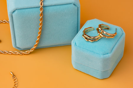 Blue jewelry box on yellow background close upの写真素材