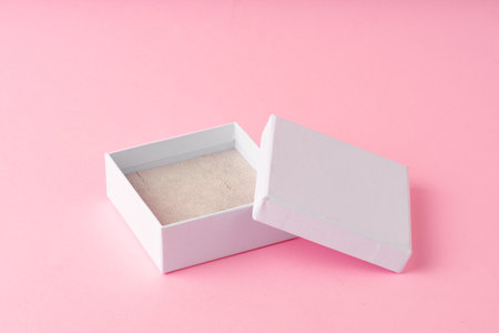 Small jewelry box on pink studio background