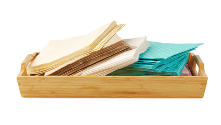 Heap of paper napkins on wooden tray on white backgroundの写真素材