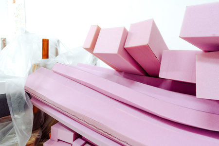 Stacked sheets of pink foam rubber in furniture production workshopの写真素材