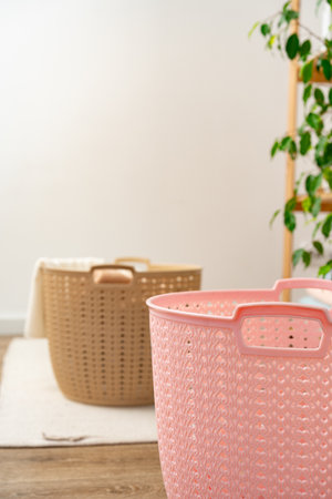 Plastic storage baskets in a bathroom interiorの写真素材
