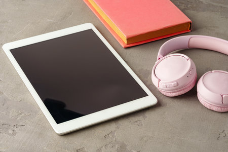 Digital tablet on gray background close upの写真素材