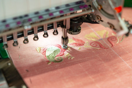 Close up of embroidery machine making patterns on textilesの写真素材