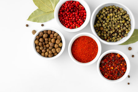 Various spices in a bowls on white backgroundの写真素材