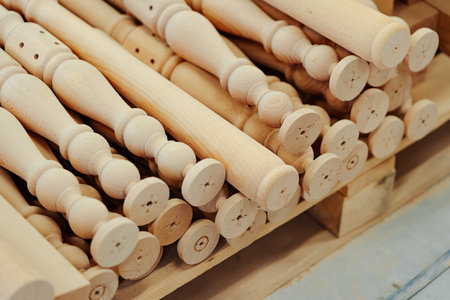 Wooden baluster stacked on the floor in woodwork workshopの写真素材