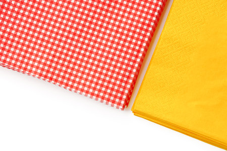 Two stacks of colorful paper napkins on white backgroundの写真素材