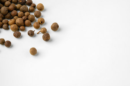 Pile of allspice isolated on white backgroundの写真素材