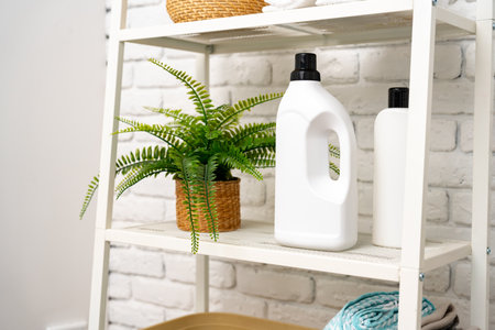 Liquid detergents containers on shelf in a bathroomの写真素材